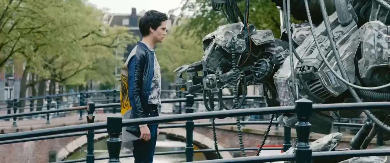 A wide frame from Tears of Steel: Tom stands on a bridge, left of centre, next to a giant robot that fills the right of the picture. A yellow box marks his face; the red 9:16 crop and the green 4:5 crop are drawn around him, and the robot falls outside both.